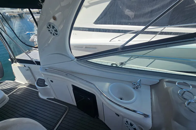 Slide: The Image of Interior view of 2005 Sea Ray 300 Sundancer yacht with sink and seating area. - 4