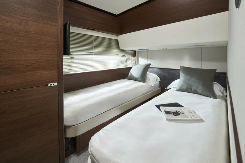 Slide: The Image of Luxurious twin cabin in 2026 Princess F65-079 yacht with modern decor and plush bedding. - 13