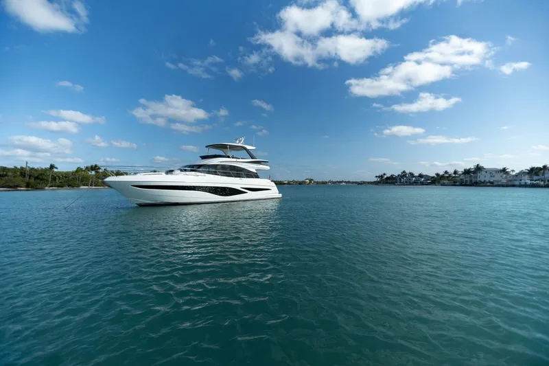 Slide: The Image of Luxurious 2026 Princess F65-079 yacht on serene blue waters under a clear sky. - 16