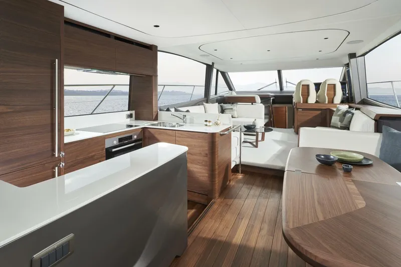 Slide: The Image of Luxurious interior of 2026 Princess F65-079 yacht with modern kitchen and seating area. - 5