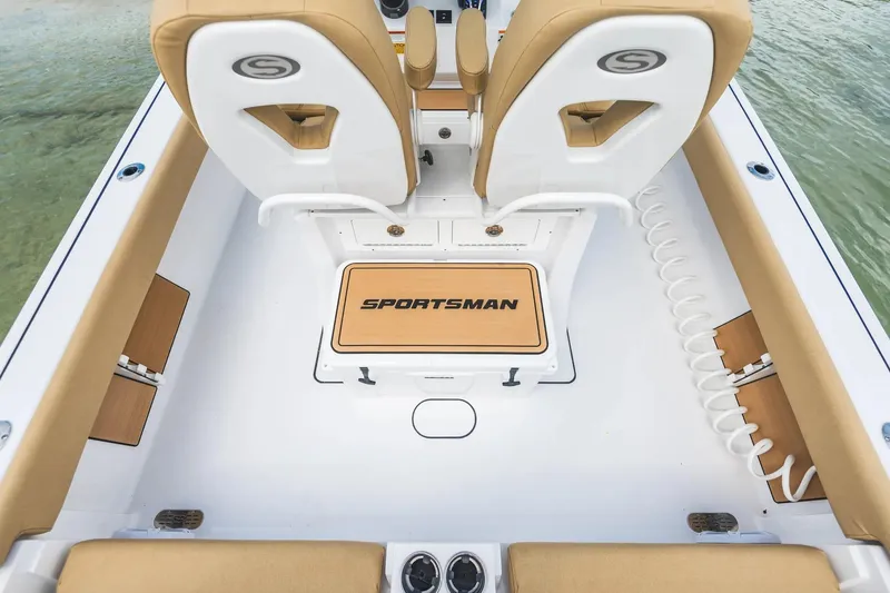 Slide: The Image of 2026 Sportsman Masters 267 Bay Boat interior with tan seating and logo. - 18