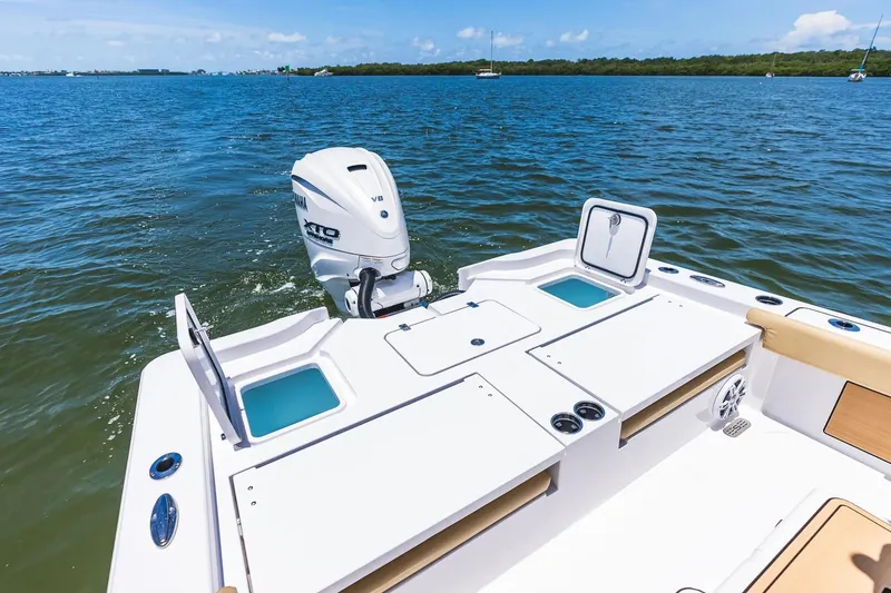 Slide: The Image of 2026 Sportsman Masters 267 Bay Boat with Yamaha XTO engine on open water. - 19