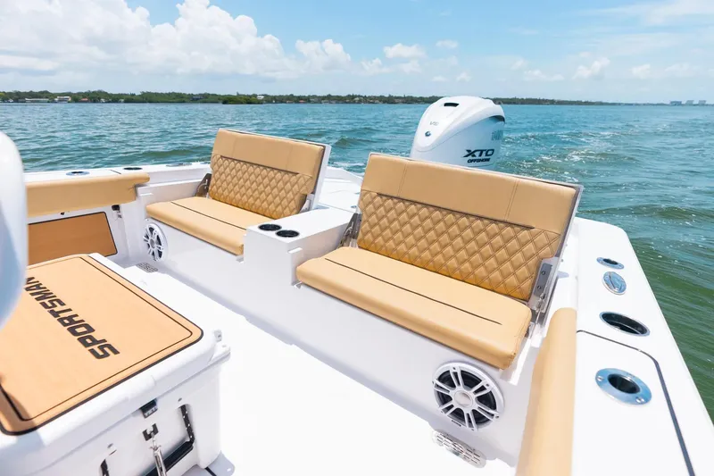 Slide: The Image of 2026 Sportsman Masters 267 Bay Boat with tan seating on open water. - 21