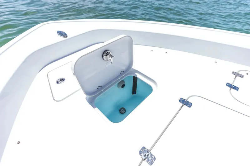 Slide: The Image of 2026 Sportsman Masters 267 Bay Boat with open storage compartment on deck. - 4