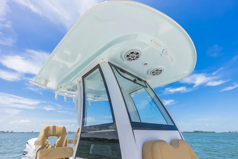 Slide: The Image of 2026 Sportsman Masters 267 Bay Boat with sleek design and modern features against blue sky. - 9