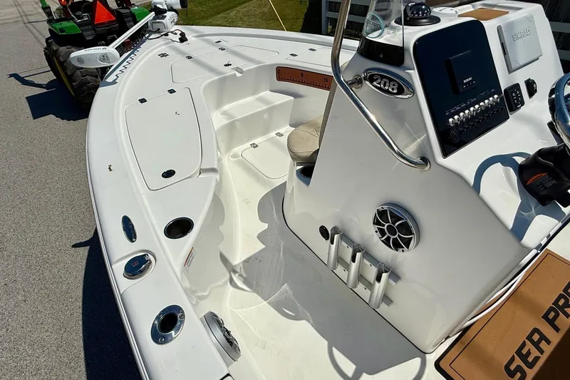 Slide: The Image of 2021 Sea Pro 208 Bay boat interior with control panel and seating. - 12