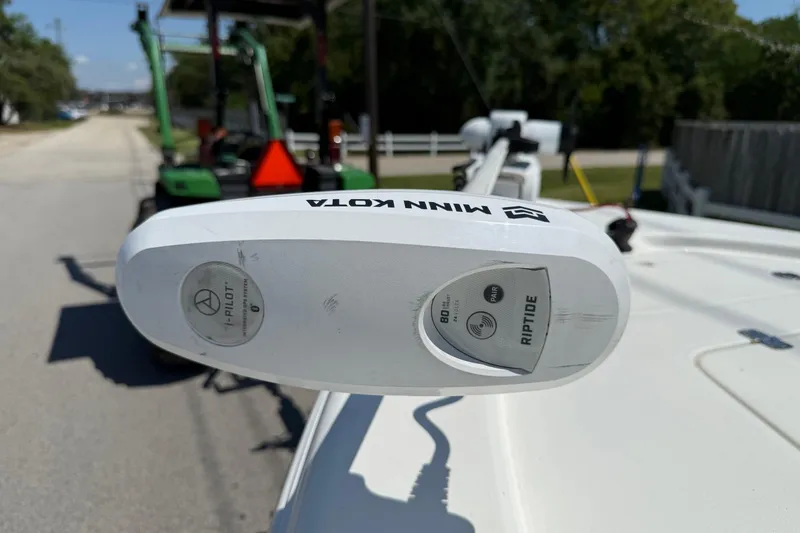 Slide: The Image of Minn Kota Riptide motor on 2021 Sea Pro 208 Bay boat, parked outdoors. - 17