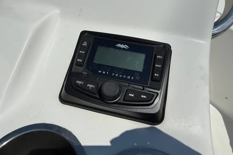 Slide: The Image of Wet Sounds audio control panel on 2021 Sea Pro 208 Bay boat dashboard. - 18