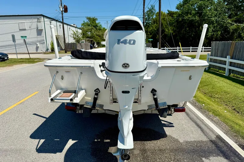 Slide: The Image of 2021 Sea Pro 208 Bay boat with 140 horsepower engine on a sunny street. - 3