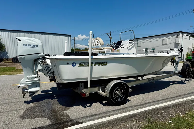 Slide: The Image of 2021 Sea Pro 208 Bay boat on trailer with Suzuki outboard motor. - 4