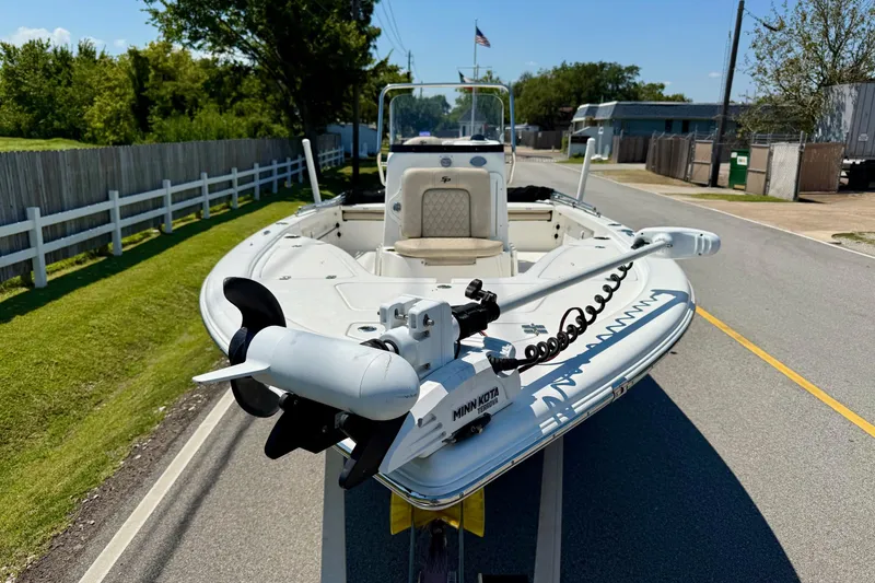 Slide: The Image of 2021 Sea Pro 208 Bay boat with Minn Kota trolling motor on a road. - 6