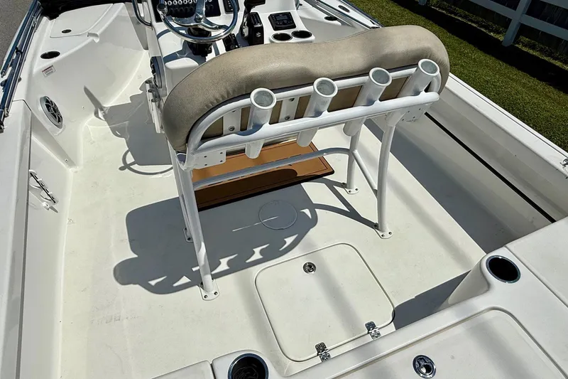 Slide: The Image of 2021 Sea Pro 208 Bay boat interior with seating and rod holders. - 9