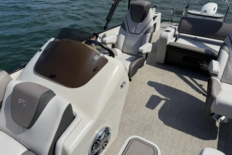 Slide: The Image of 2023 Avalon Catalina Versatile Rear Bench boat interior with luxurious seating and helm. - 14