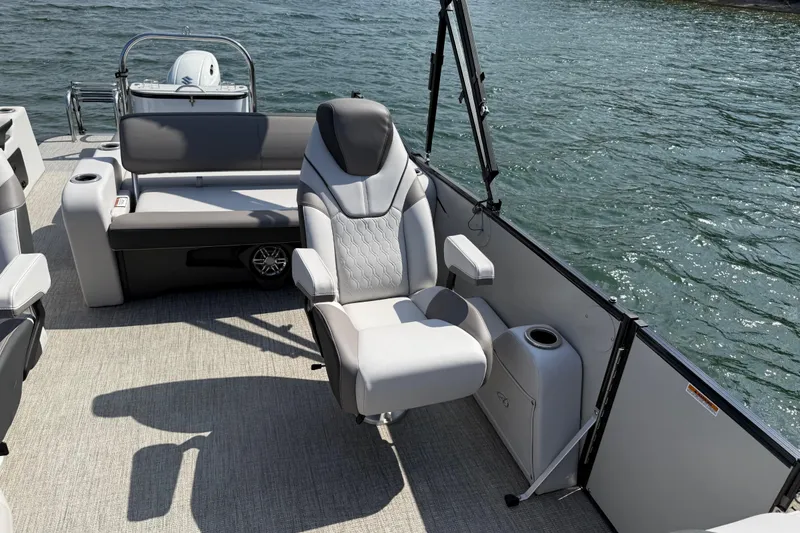 Slide: The Image of 2023 Avalon Catalina Versatile Rear Bench boat interior with luxurious seating on water. - 15