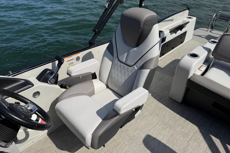 Slide: The Image of 2023 Avalon Catalina Versatile Rear Bench boat interior with luxurious captain's chair. - 16