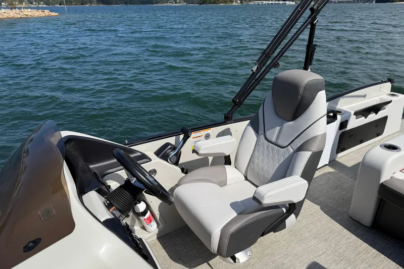 Slide: The Image of 2023 Avalon Catalina boat interior with versatile rear bench and captain's chair. - 17