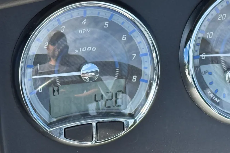 Slide: The Image of Close-up of 2023 Avalon Catalina Versatile Rear Bench boat dashboard gauges. - 20