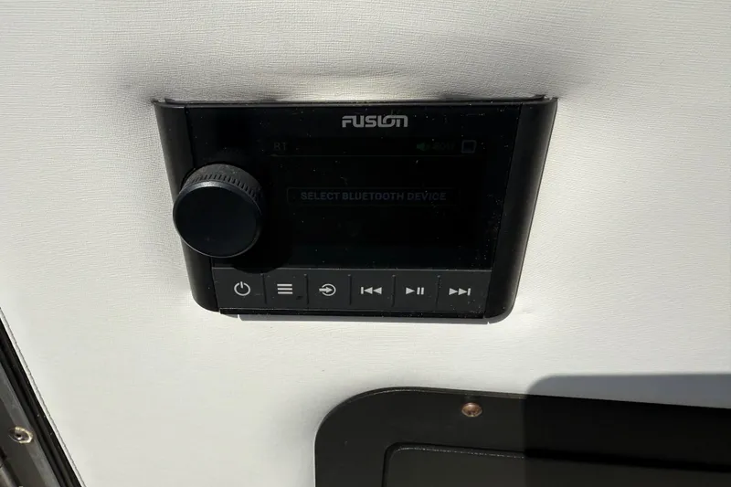 Slide: The Image of Fusion audio control panel on 2023 Avalon Catalina Versatile Rear Bench boat. - 27