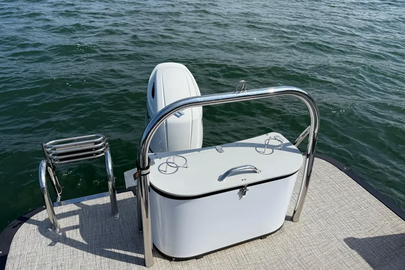 Slide: The Image of 2023 Avalon Catalina Versatile Rear Bench on water, featuring sleek design and sturdy railing. - 28
