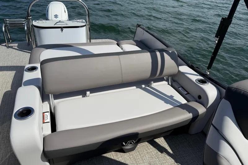 Slide: The Image of 2023 Avalon Catalina Versatile Rear Bench on water, featuring comfortable seating and cup holders. - 33