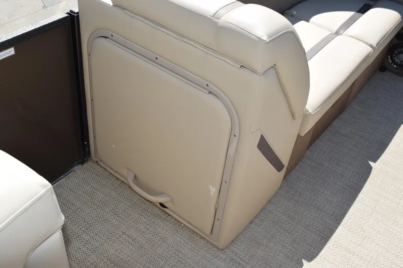 Slide: The Image of 2024 Crest Classic LX 220 L boat interior seating with storage compartment. - 12