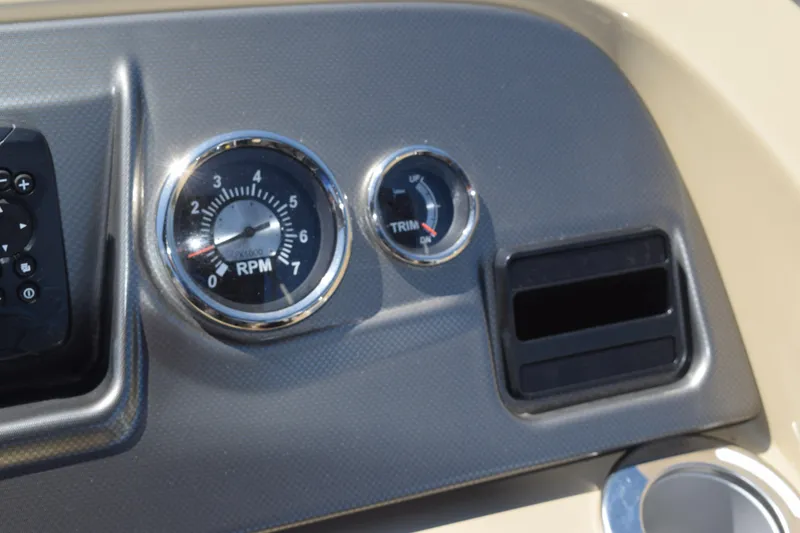 Slide: The Image of Dashboard of 2024 Crest Classic LX 220 L with RPM and trim gauges. - 16