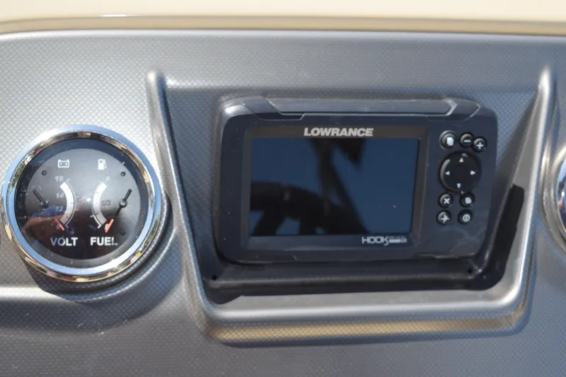 Slide: The Image of Dashboard of 2024 Crest Classic LX 220 L with Lowrance display and gauges. - 17