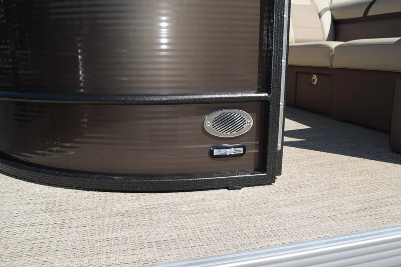 Slide: The Image of 2024 Crest Classic LX 220 L boat interior with speaker and seating detail. - 25