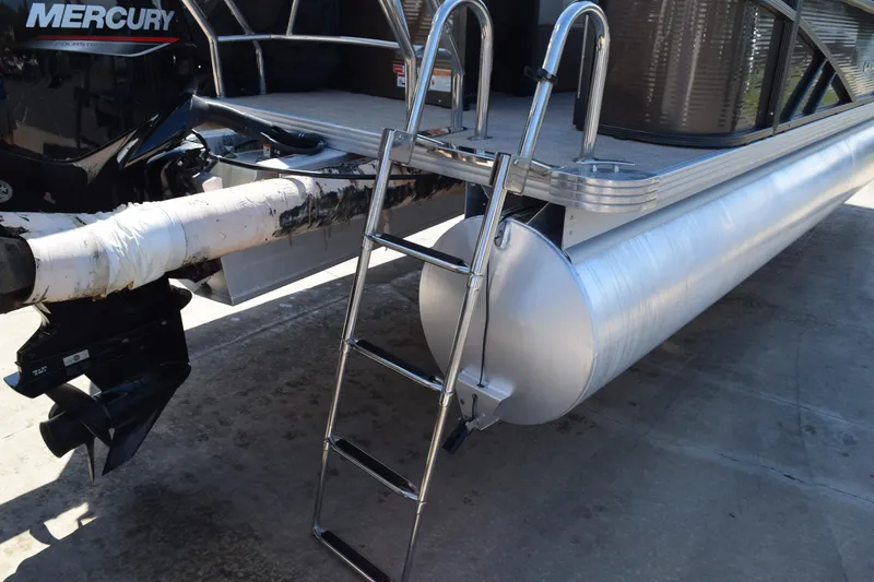 Slide: The Image of 2024 Crest Classic LX 220 L pontoon boat with Mercury engine and boarding ladder. - 5