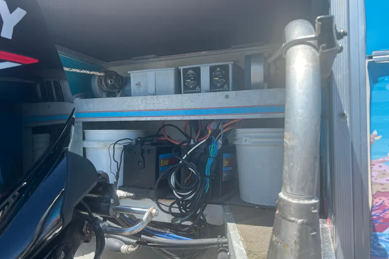 Slide: The Image of Interior view of a 2005 G3 LX20 boat showing batteries and equipment storage. - 14