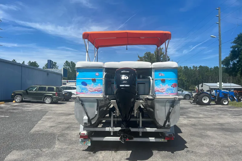 Slide: The Image of 2005 G3 LX20 pontoon boat with orange canopy and Mercury outboard motor. - 7