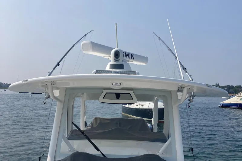 Slide: The Image of 2022 Regulator 37 boat with radar and fishing rods on calm water. - 10