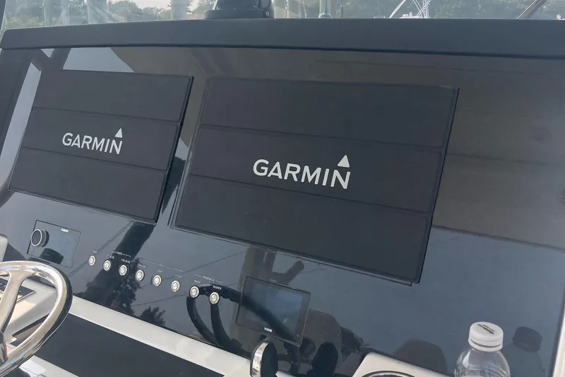 Slide: The Image of Dashboard of 2022 Regulator 37 boat with dual Garmin displays. - 14