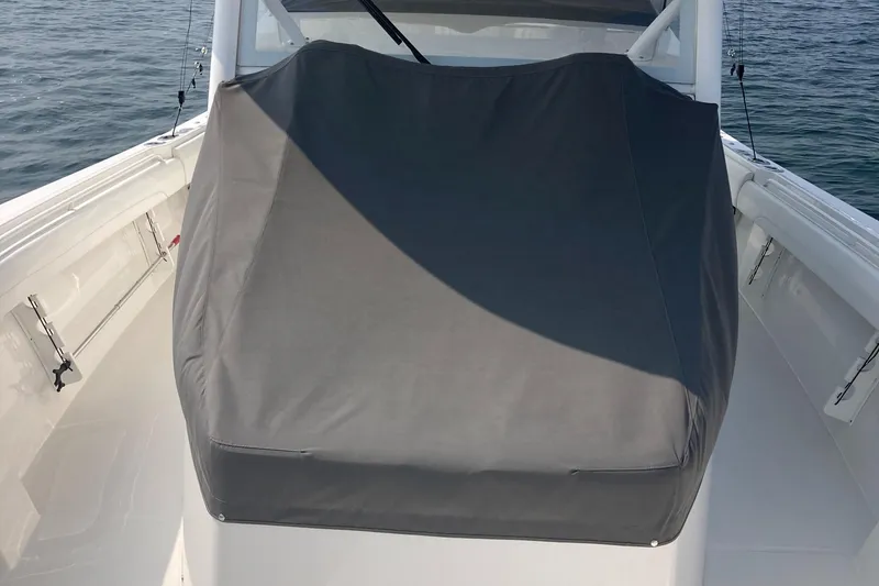 Slide: The Image of 2022 Regulator 37 boat with covered console on open water. - 15