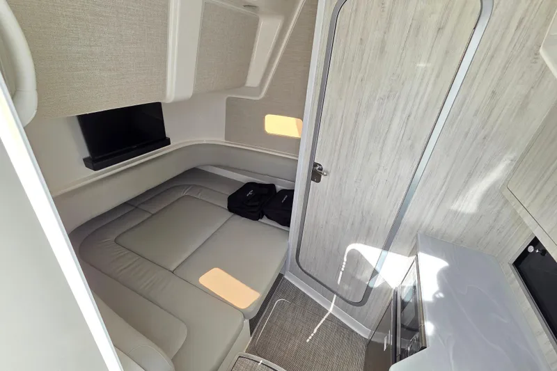 Slide: The Image of 2022 Regulator 37 cabin interior with seating, TV, and modern design. - 19