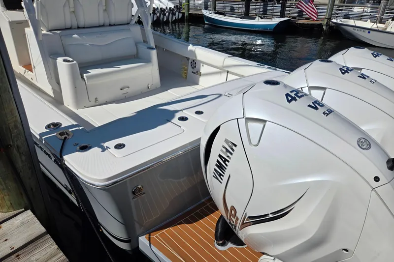 Slide: The Image of 2022 Regulator 37 boat with Yamaha 425 V8 engines docked at marina. - 21
