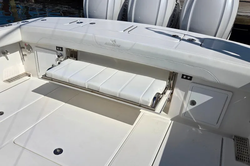 Slide: The Image of 2022 Regulator 37 boat with fold-out seating and storage compartments. - 5