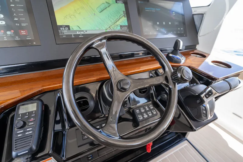 Slide: The Image of Steering console of 2021 Everglades 395 Center Console boat with modern controls and displays. - 18