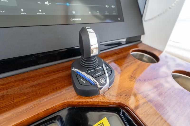 Slide: The Image of Joystick control on 2021 Everglades 395 Center Console boat dashboard. - 22