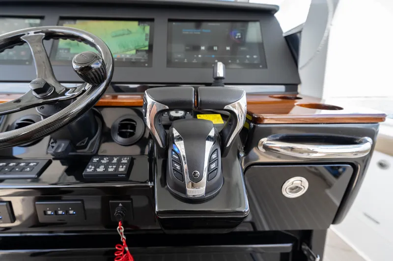 Slide: The Image of 2021 Everglades 395 Center Console helm with advanced controls and navigation displays. - 23