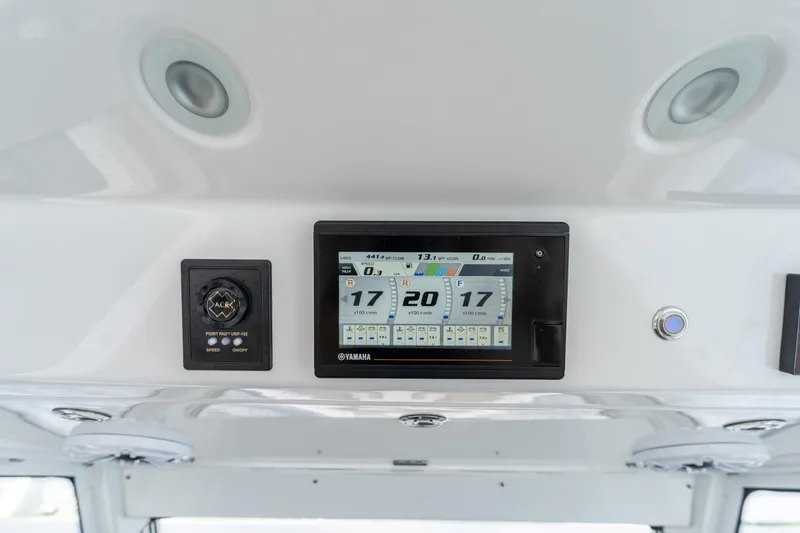 Slide: The Image of Dashboard of 2021 Everglades 395 Center Console with Yamaha display and controls. - 25