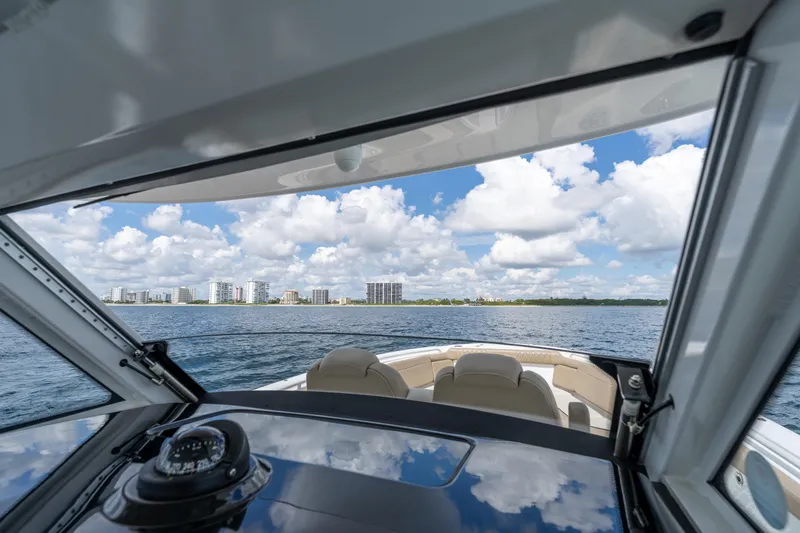 Slide: The Image of View from 2021 Everglades 395 Center Console boat, overlooking ocean and city skyline. - 26