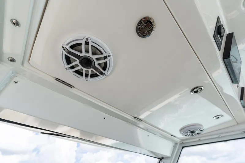 Slide: The Image of 2021 Everglades 395 Center Console boat ceiling with speakers and lighting fixtures. - 27