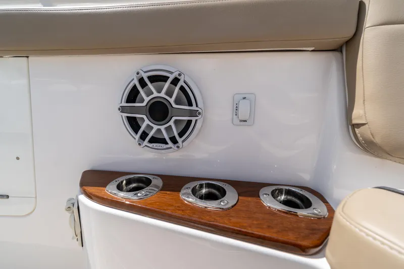 Slide: The Image of Speaker and cup holders on 2021 Everglades 395 Center Console boat interior. - 39