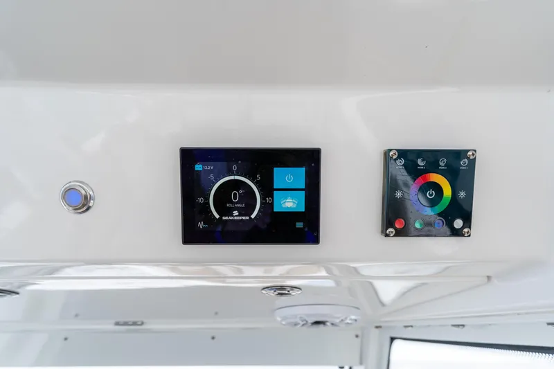 Slide: The Image of Control panel of 2021 Everglades 395 Center Console boat with digital displays. - 49