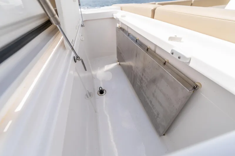 Slide: The Image of 2021 Everglades 395 Center Console boat interior detail with stainless steel components. - 57
