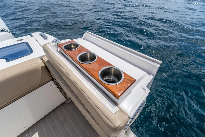 Slide: The Image of Luxury seating and cup holders on 2021 Everglades 395 Center Console boat. - 63
