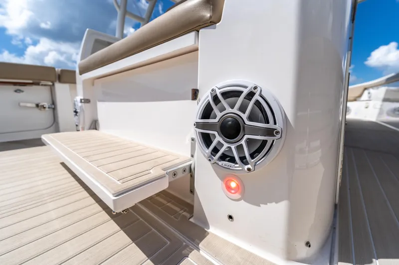 Slide: The Image of 2021 Everglades 395 Center Console boat interior with speaker and seating detail. - 66