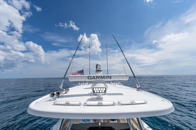 Slide: The Image of Everglades 395 Center Console 2021 boat on open sea under clear blue sky. - 73