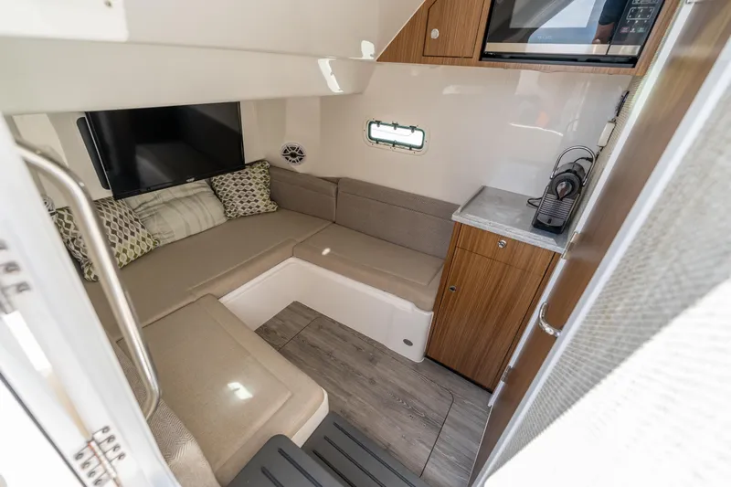 Slide: The Image of Interior of 2021 Everglades 395 Center Console, featuring cozy seating and modern amenities. - 75